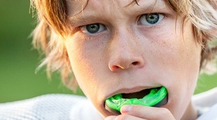 child with athletic mouthguard
