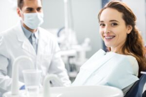 Patient smiling with their metal braces